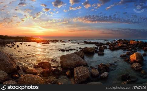 Sunset view from stony beach. Summer coastline  Greece, Zakynthos, Alykes, Ionian Sea .