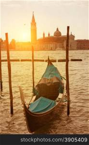 Sunset view of Venice with gondola on Grand Canal