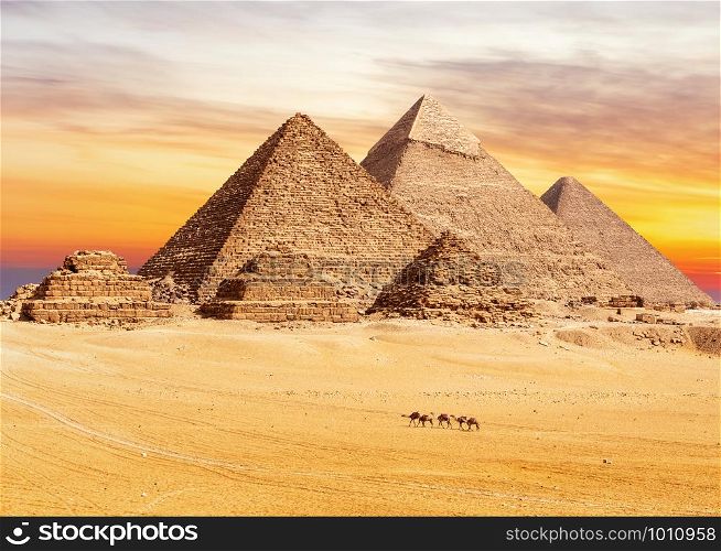 Sunset view on the famous Pyramids of Giza, Cairo, Egypt.. Sunset view on the famous Pyramids of Giza, Cairo, Egypt