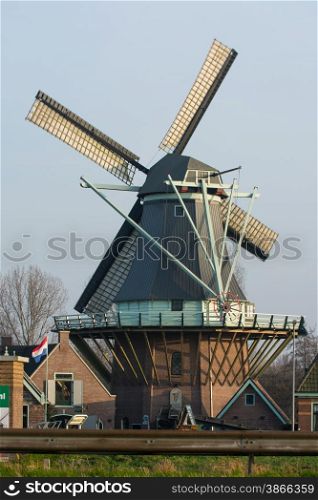 sunset with an old Dutch windmill