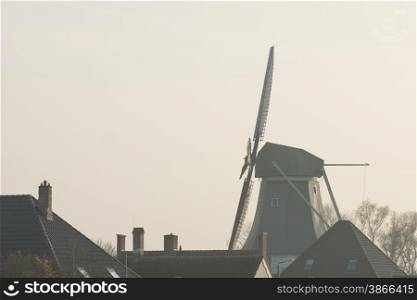 sunset with an old Dutch windmill