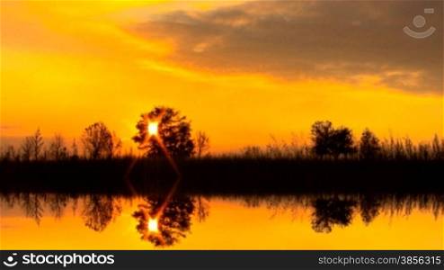 Sunset with beautiful clouds in reflexion.