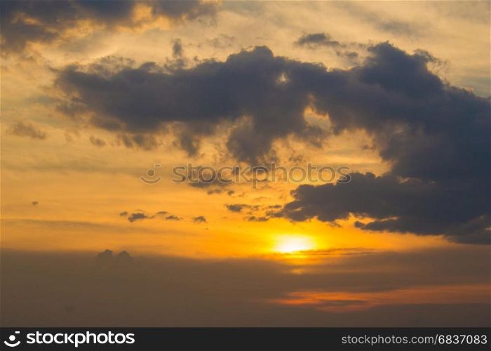 Sunset with clouds and light ray.