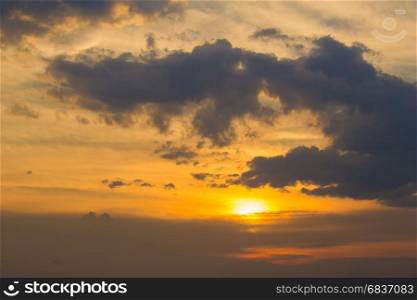 Sunset with clouds and light ray.