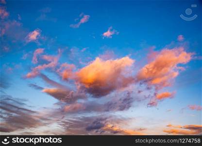 Sunset with dramatic sky and colorful clouds. Background. Sunset with dramatic sky and colorful clouds