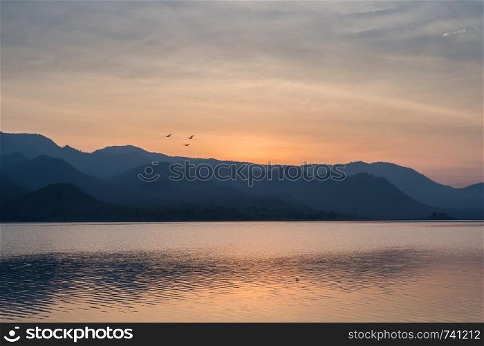 Sunset with lake and mountain landscape