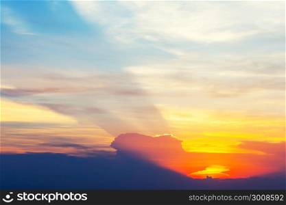 Sunset with sun rays in the sky. Beautiful nature background.