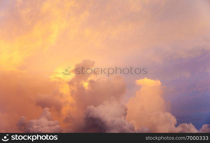 Sunset with sun rays, sky with clouds and sun.