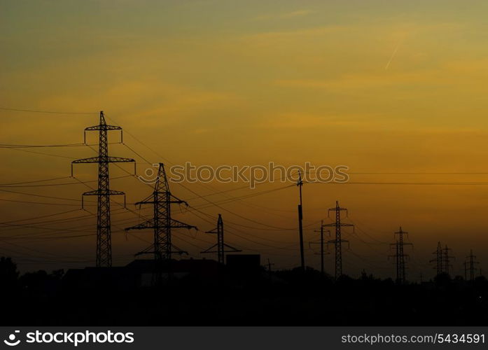 Sunseton the road in summer and different electrified track