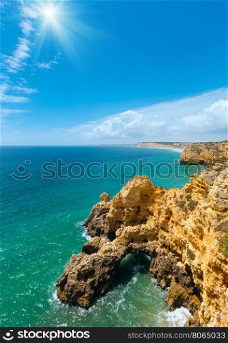 Sunshine above Atlantic ocean summer rocky coastline (Ponta da Piedade, Lagos, Algarve, Portugal).