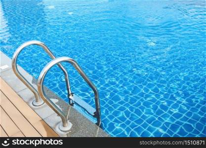 sunshine and clear water of swimming pool