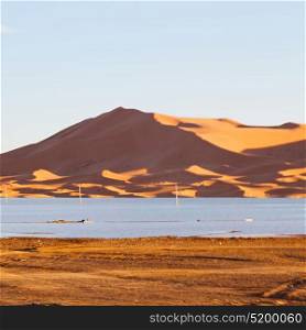 sunshine in the desert of morocco sand and lake dune
