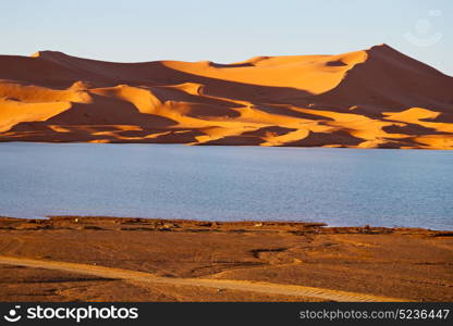 sunshine in the desert of morocco sand and lake dune