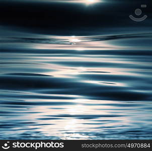 Sunshine sparkling sea waves at sunset beach