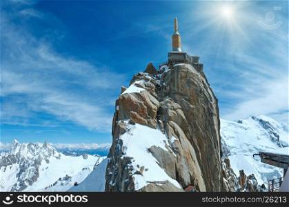 Sunshiny mountain top station of the Aiguille du Midi in Chamonix, France. All peoples is unrecognizable
