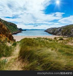 Sunshiny sandy beach (Spain) Atlantic Ocean coastline landscape.