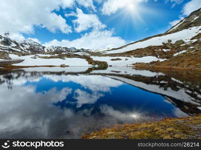 Sunshiny spring alps mountain lake Lago della Piazza (Switzerland, Passo del San Gottardo)