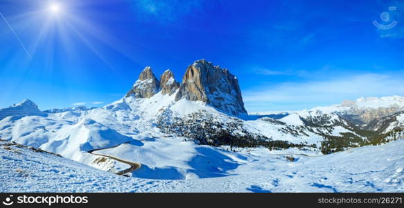 Sunshiny winter mountain landscape with road (Sella Pass , Italy).