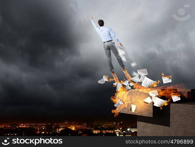 Super businessman. Rear view of businessman superhero flying up in sky