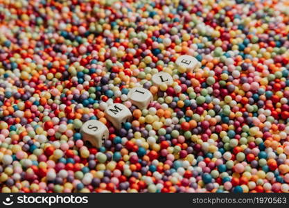 Super colorful mock up with happy and fun concept, colorful balls with Smile written in dices, background, stunning, wonderful