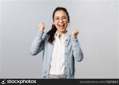 Super cool news, good for you. Optimistic, supportive asian girl encourage friend, watching sports game and rooting for team, chanting and smiling, triumphing from success, celebrate victory.. Super cool news, good for you. Optimistic, supportive asian girl encourage friend, watching sports game and rooting for team, chanting and smiling, triumphing from success, celebrate victory