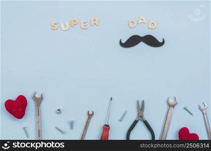 super dad inscription with tools paper mustache