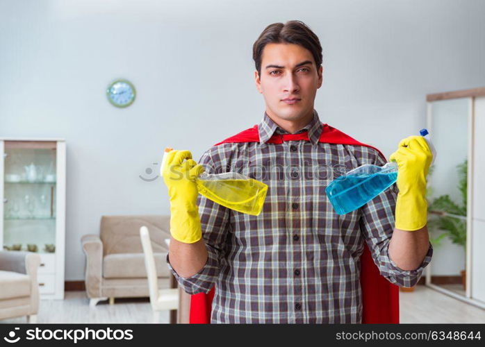 Super hero cleaner working at home