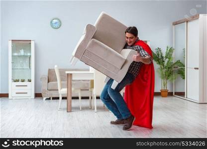 Super hero moving furniture at home
