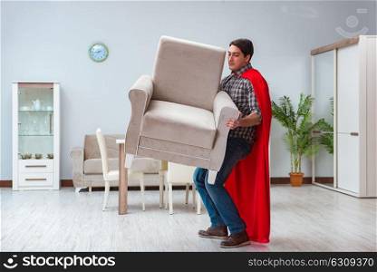 Super hero moving furniture at home