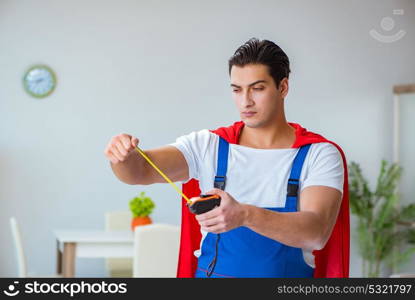 Super hero repairman working at home