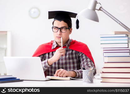 Super hero student wearing a mortarboard studying for exams