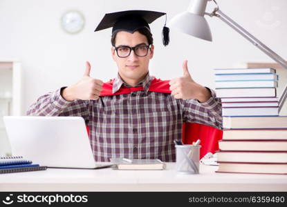 Super hero student wearing a mortarboard studying for exams