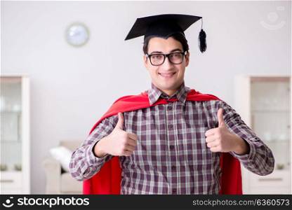 Super hero student wearing mortarboard in a red cloak