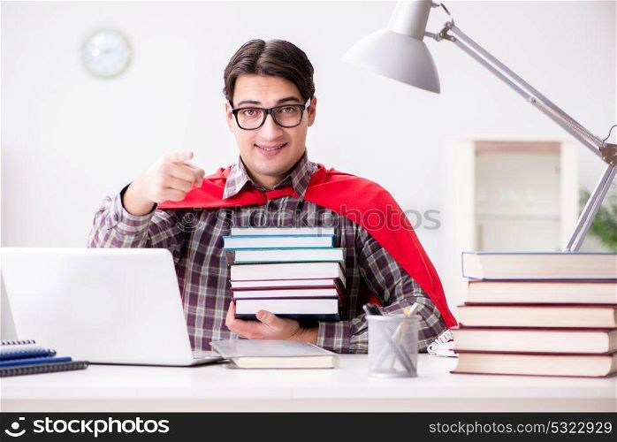 Super hero student with a laptop studying preparing for exams