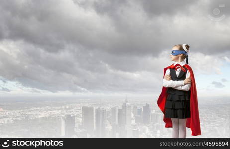 Super kid. Girl of school age in super hero costume