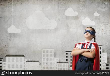 Super kid. Girl of school age in super hero costume