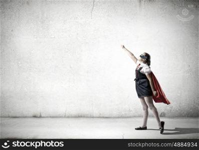 Super kid. Girl of school age in super hero costume