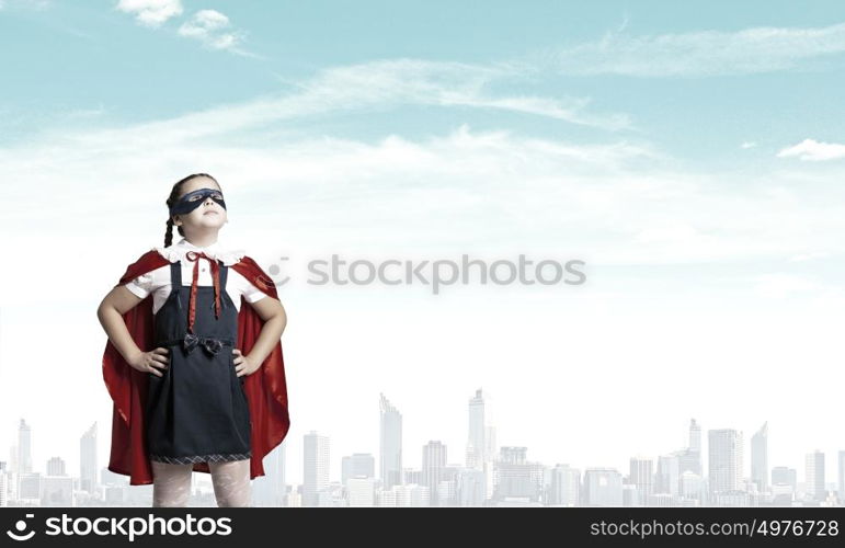 Super kid. Girl of school age in super hero costume