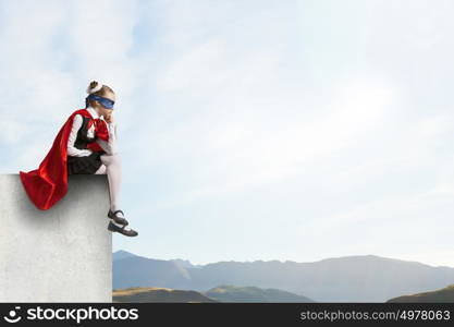 Super kid. Girl of school age in super hero costume