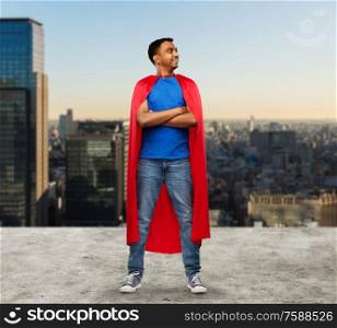 super power and people concept - happy smiling indian man in red superhero cape with crossed arms over tokyo city background. happy indian man in red superhero cape in tokyo