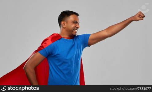 super power and people concept - indian man in red superhero cape making winning gesture over grey background. indian man in superhero cape makes winning gesture