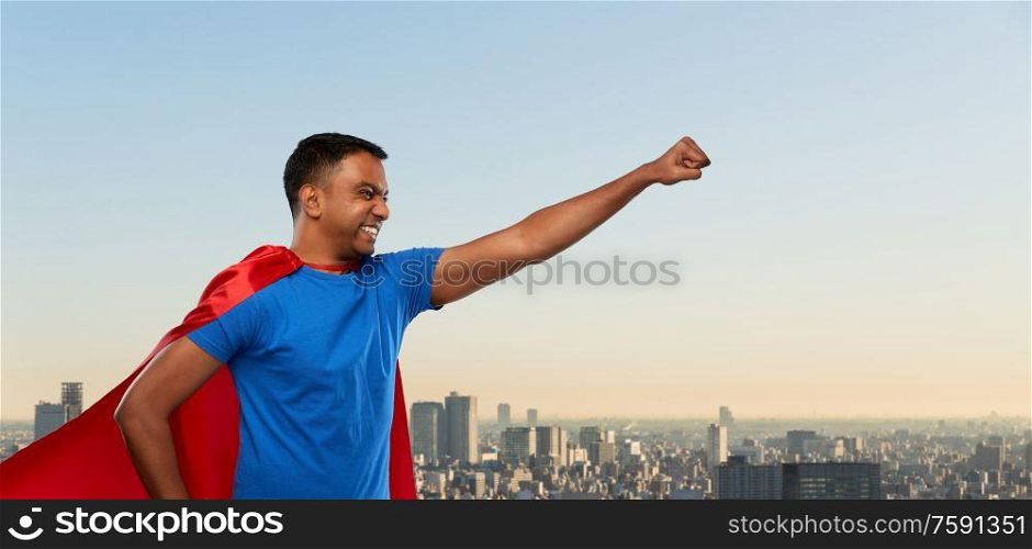 super power and people concept - indian man in red superhero cape making winning gesture over tokyo city background. indian man in superhero cape makes winning gesture