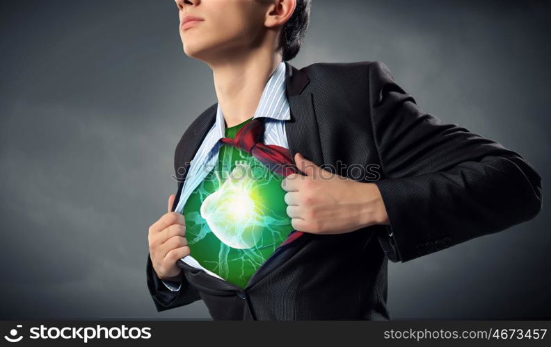 Super professional. Businessman opening his shirt on chest acting like super hero