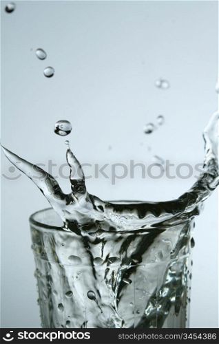 super splash in glass on white background