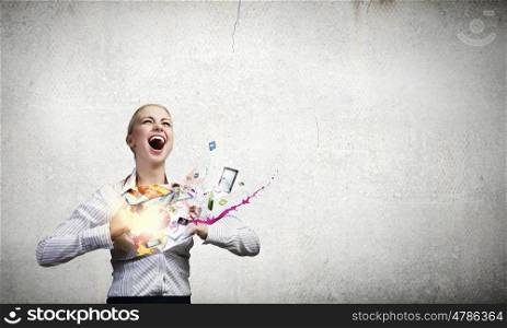 Super woman. Young woman tearing shirt on chest and icons flying out