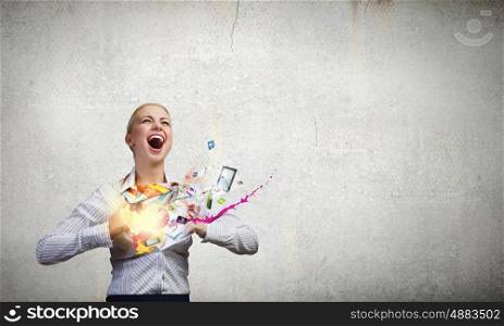 Super woman. Young woman tearing shirt on chest and splashes flying out