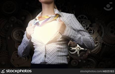Super woman. Young woman tearing shirt on chest. Mechanism concept