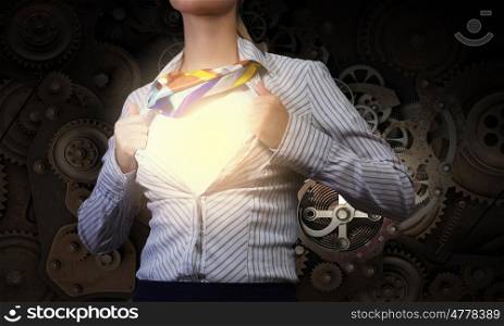 Super woman. Young woman tearing shirt on chest. Mechanism concept