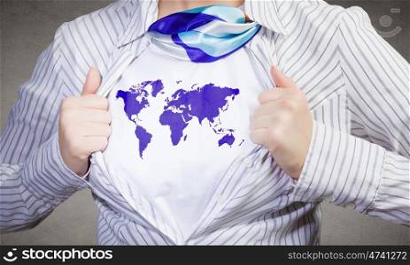 Super woman. Young woman tearing shirt on chest with world map