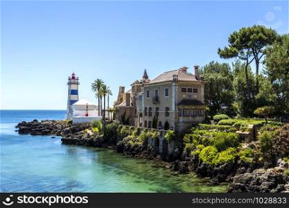 Superb view of the inlet along the rocky coastline near the Santa Marta Lighthouse in Cascais, Portugal